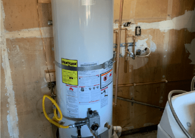 a large water heater in a room, likely a basement or a utility area